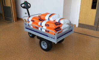 Electric platform truck carrying bagged materials
